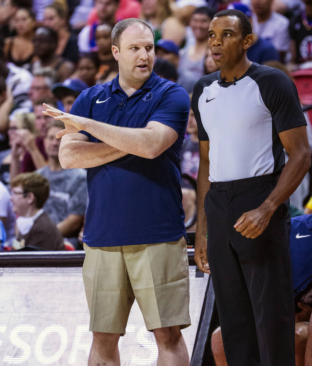 Memphis Grizzlies head coach Taylor Jenkins discusses a call with a referee during the first pe ...