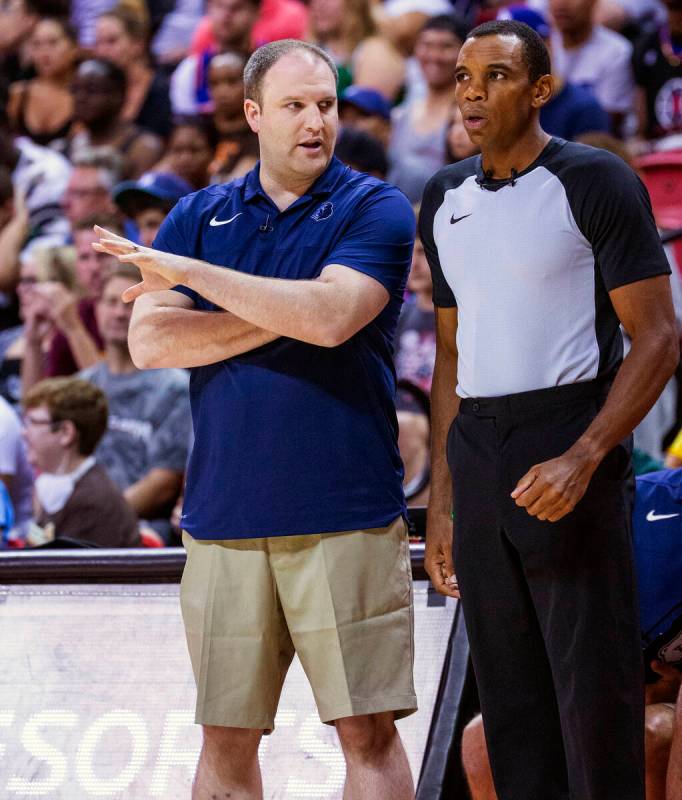 Memphis Grizzlies head coach Taylor Jenkins discusses a call with a referee during the first pe ...