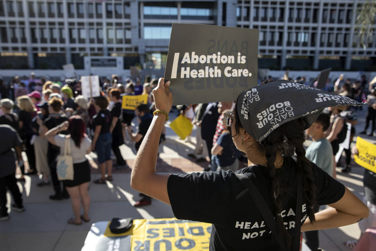 Iliana Diaz, education program manager at Planned Parenthood of the Rocky Mountains, protests d ...