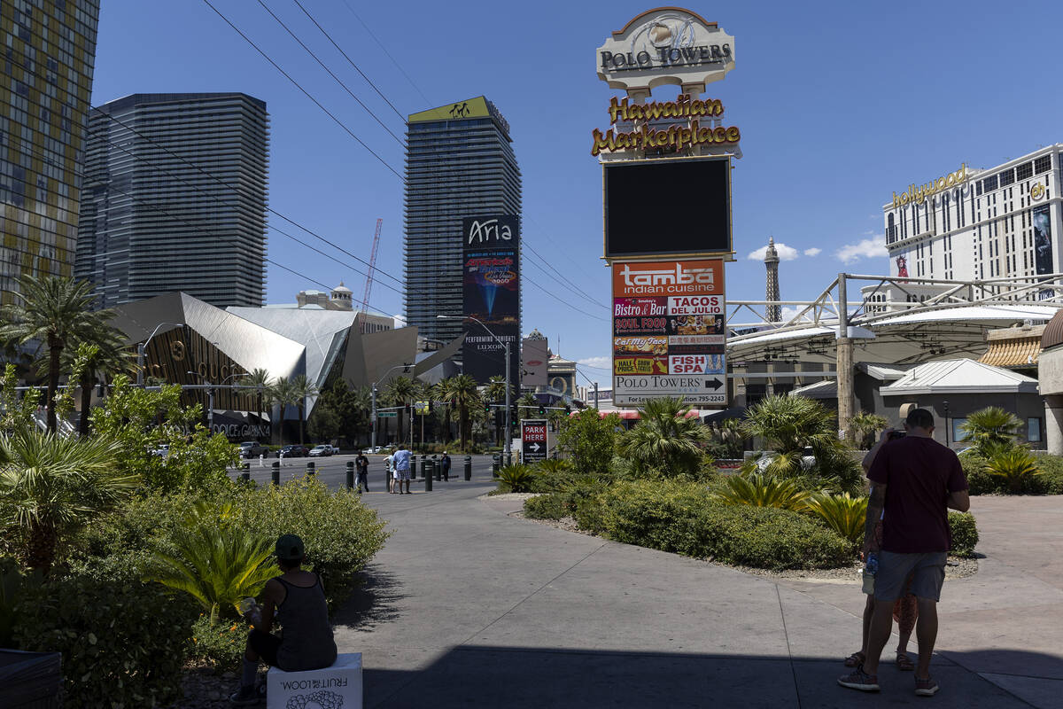 The sign for Hawaiian Marketplace is seen among hotel-casino high rises, Wednesday, June 29, 20 ...