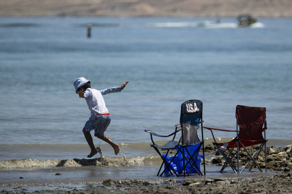 A child jumps in the water at Lake Mead in Las Vegas, Monday, May 30, 2022. (Erik Verduzco / La ...