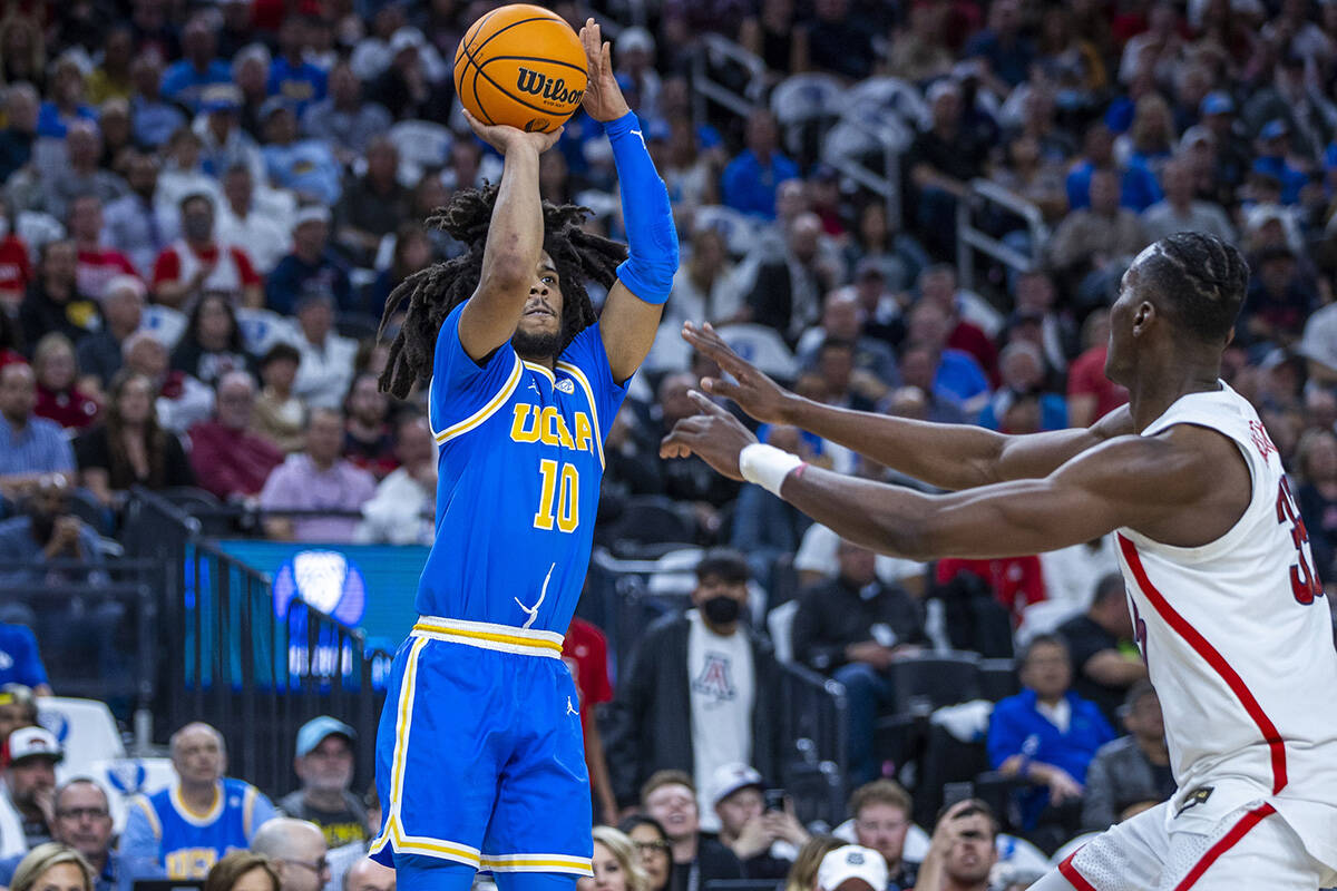 UCLA Bruins guard Tyger Campbell (10) elevates for a three-point basket over Arizona Wildcats c ...