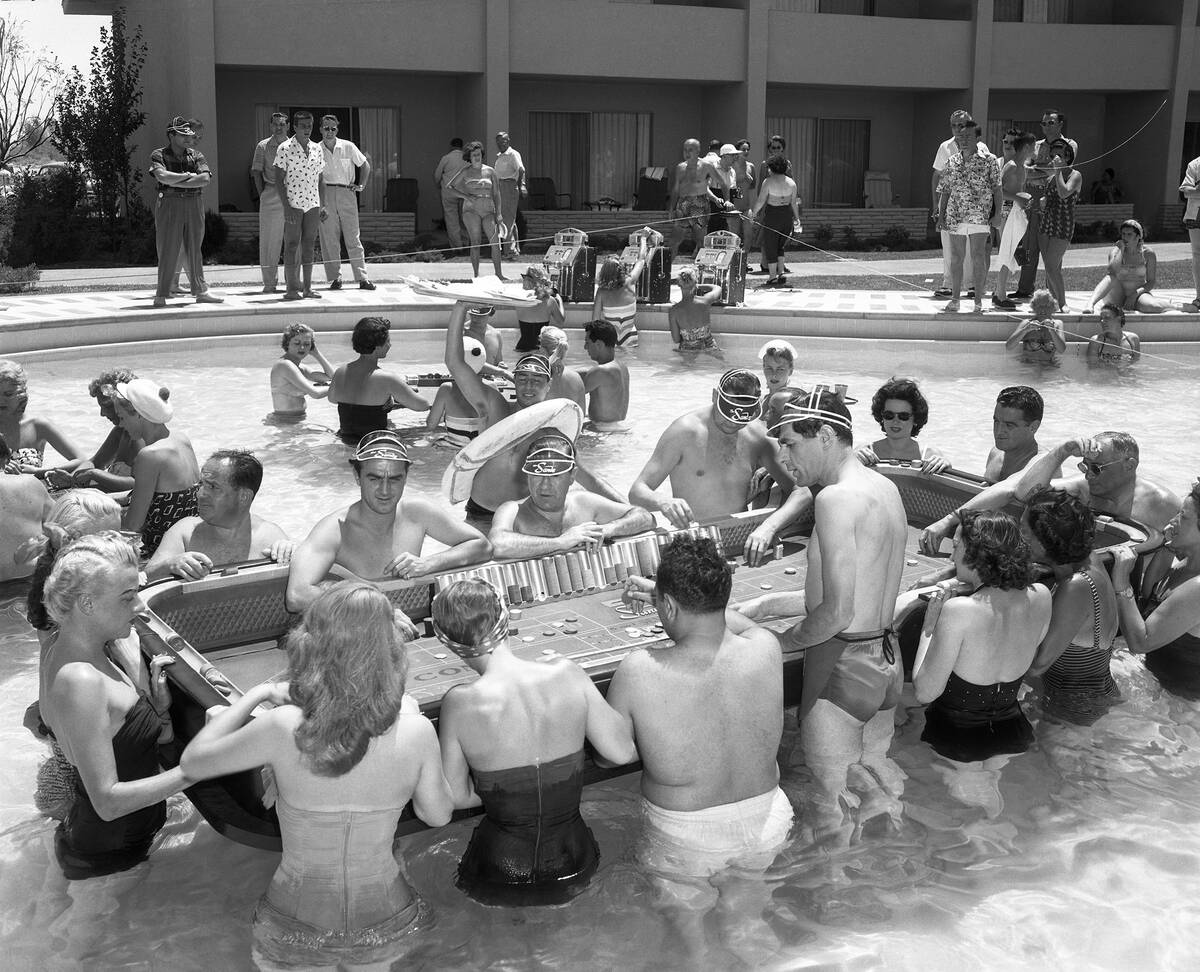 Gamblers play at the floating craps game in the Sands pool on June 30, 1953. (Las Vegas News Bu ...