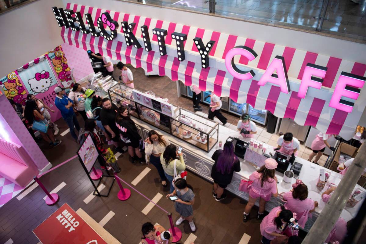 Customers wait in line at the new Hello Kitty Cafe during the grand opening inside Fashion Show ...