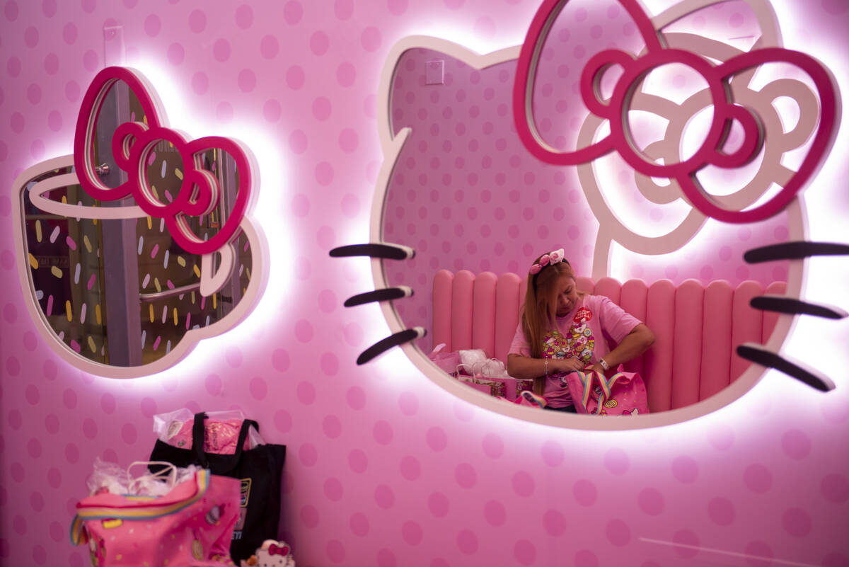 Kookie Lai sits in one of the seating areas at the new Hello Kitty Cafe inside Fashion Show Mal ...