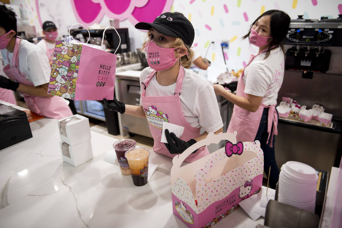 Ani Phanthip works the counter at the new Hello Kitty Cafe inside Fashion Show Mall during its ...