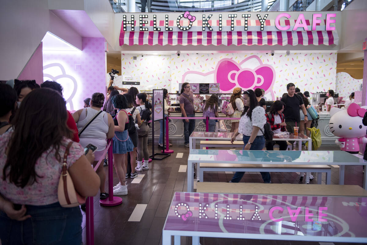 Customers wait in line at the new Hello Kitty Cafe during the grand opening inside Fashion Show ...