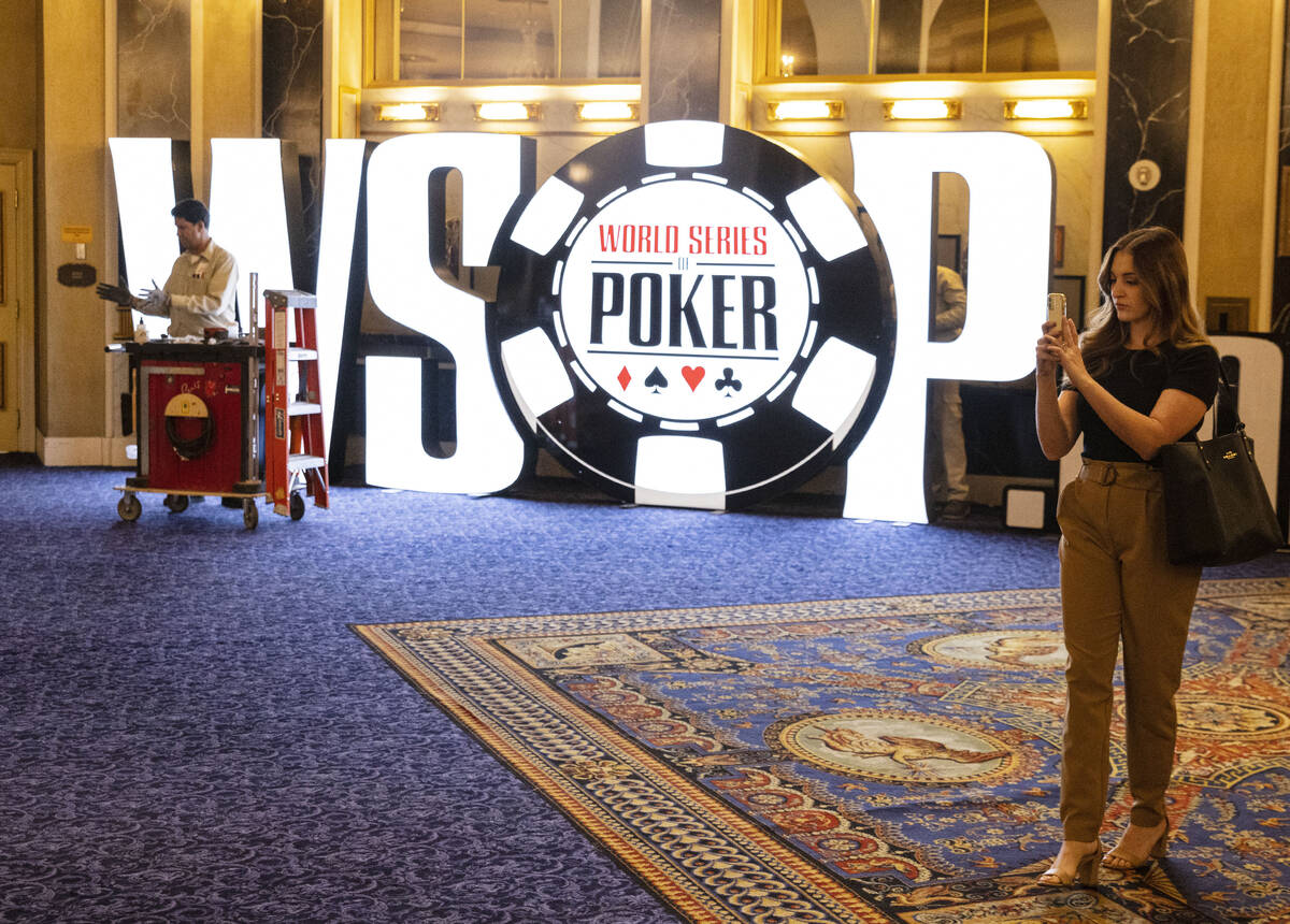 David Hemby, a carpenter, installs the WSOP sign at Paris Las Vegas hotel-casino on Thursday Ma ...