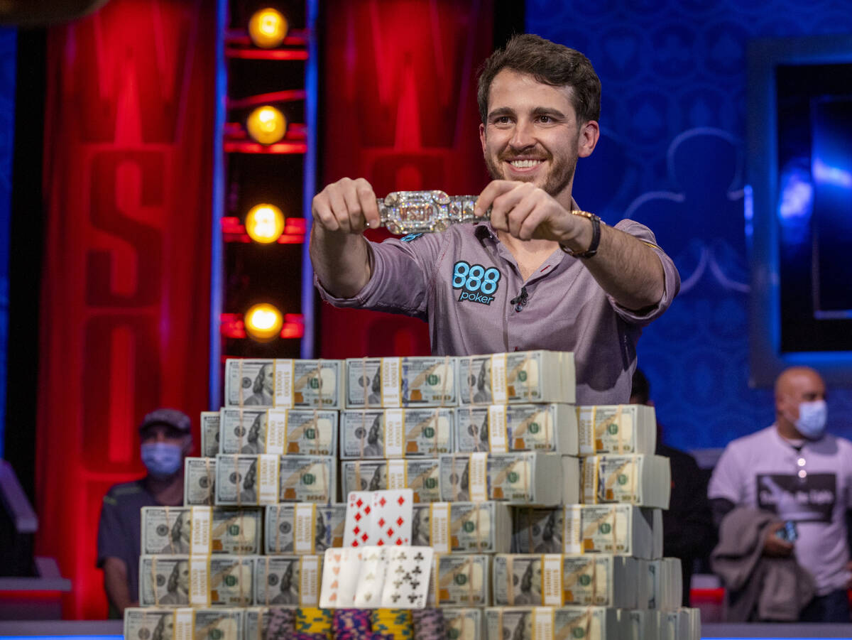 Winner Koray Aldemir with his bracelet and stacks of cash at the final table for the $10,000 bu ...
