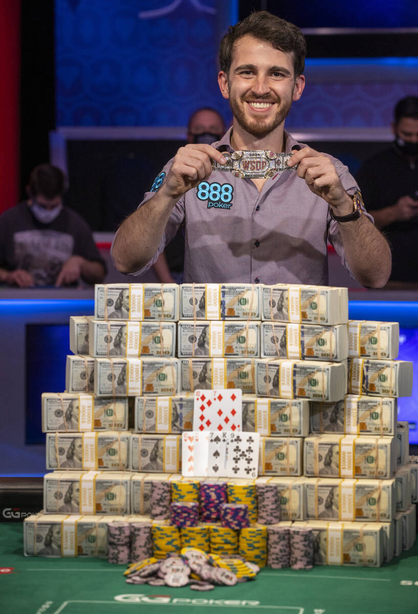 Winner Koray Aldemir with his bracelet and stacks of cash at the final table for the $10,000 bu ...