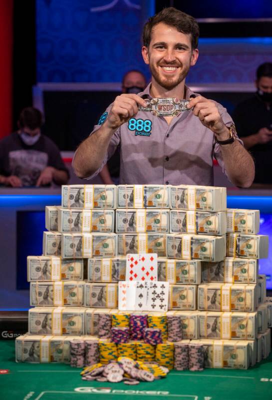 Winner Koray Aldemir with his bracelet and stacks of cash at the final table for the $10,000 bu ...