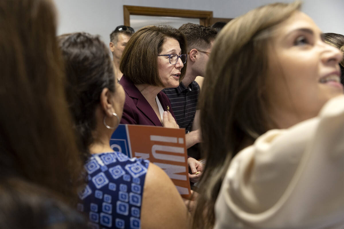Sen. Catherine Cortez Masto, D-Nev., center, speaks with supporters after a news conference foc ...
