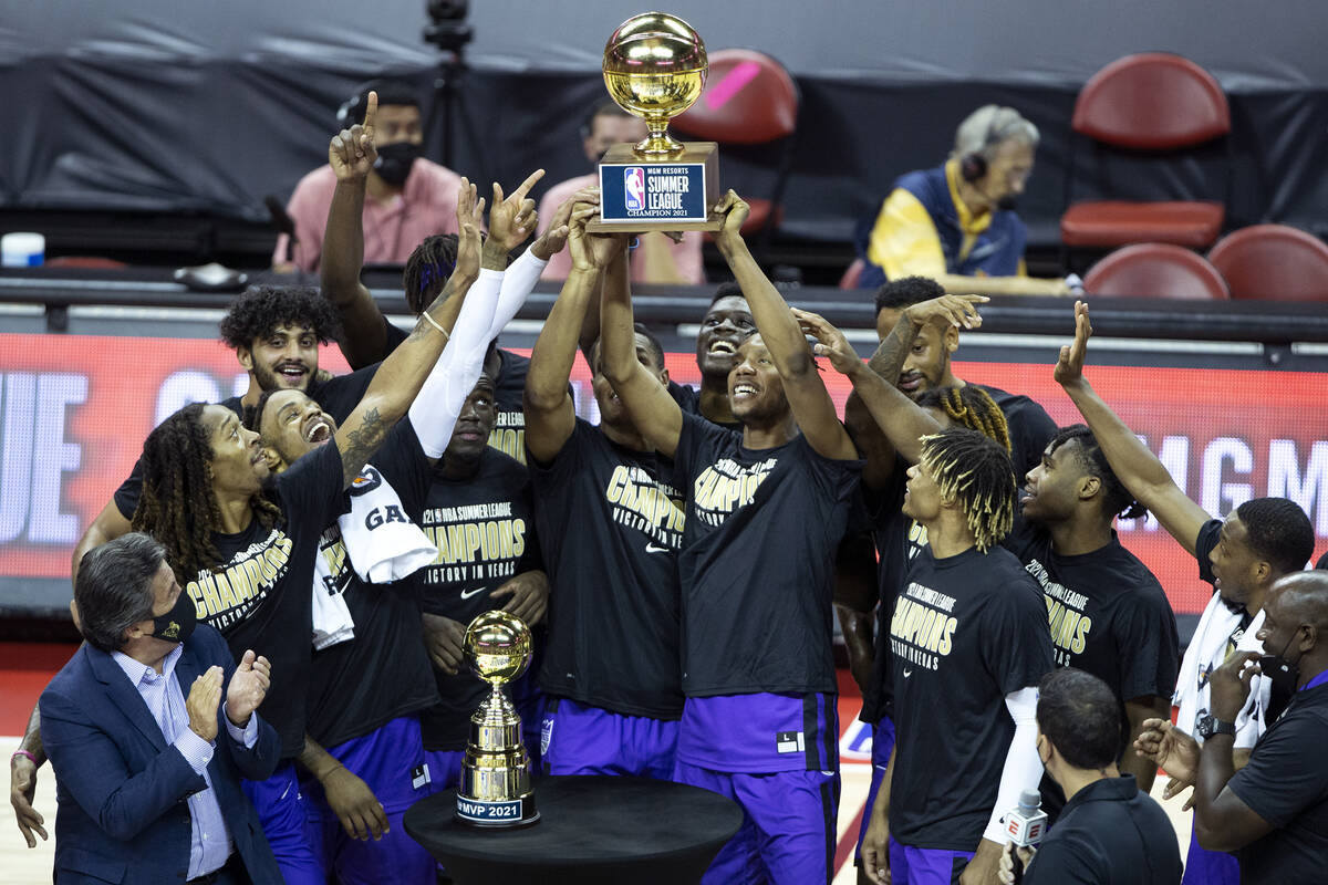 The Sacramento Kings hold up their winning trophy after beating the Boston Celtics in a NBA Sum ...