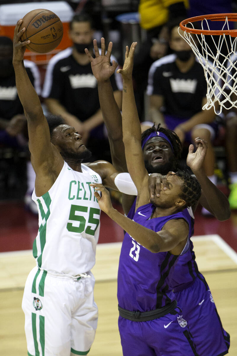 Boston Celtics center Bruno Fernando (55) attempts to score while Sacramento Kings forward Loui ...