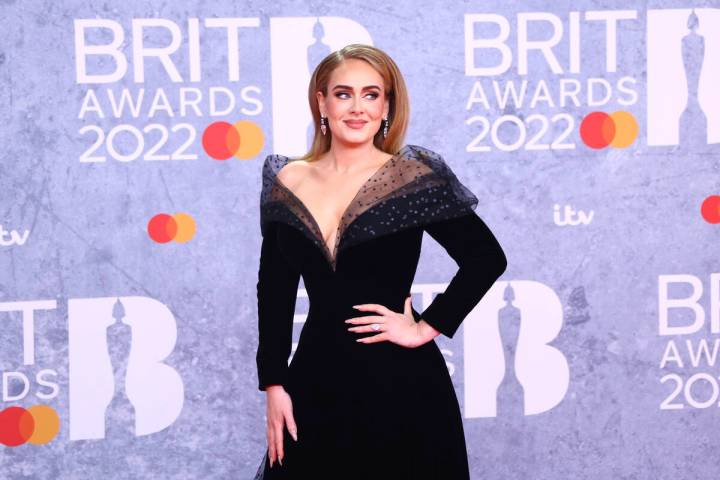 Adele poses for photographers upon arrival at the Brit Awards 2022 in London Tuesday, Feb. 8, 2 ...