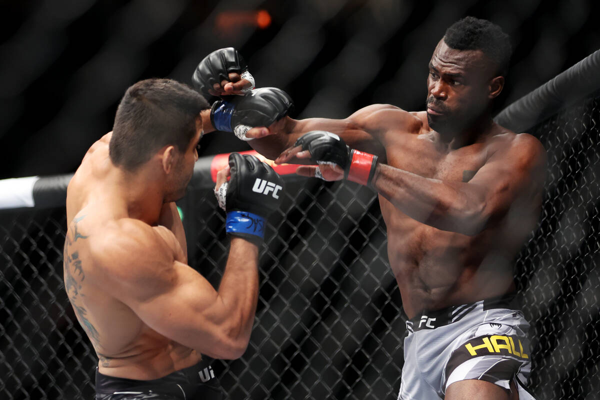 Andre Muniz, left, and Uriah Hall, battle during the first round in a middleweight bout at T-Mo ...