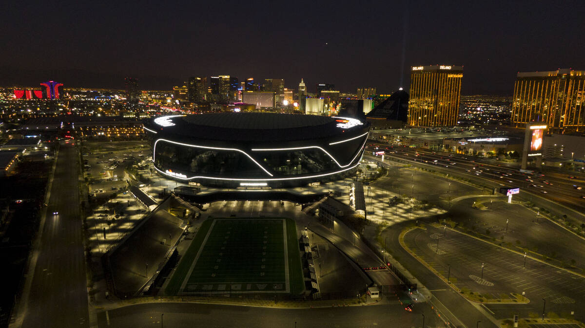 Aerial view of Allegiant Stadium and the Las Vegas Strip at dusk on Thursday, January 6, 2022. ...