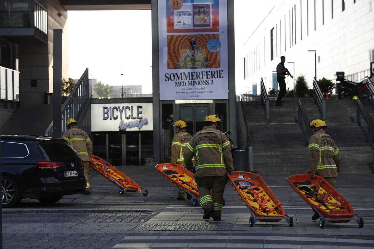 Emergency services at the Field's shopping center after a shooting, in Copenhagen, Denmark, Sun ...