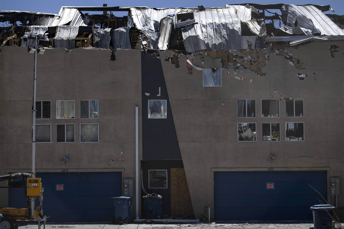 Emily Smith’s rental unit, right, is damaged from the fire that destroyed at least 10 bu ...