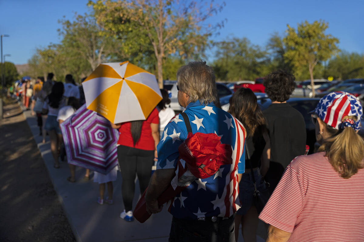 Attendees wait in line to enter Heritage Park for a Fourth of July celebration on Monday, July ...
