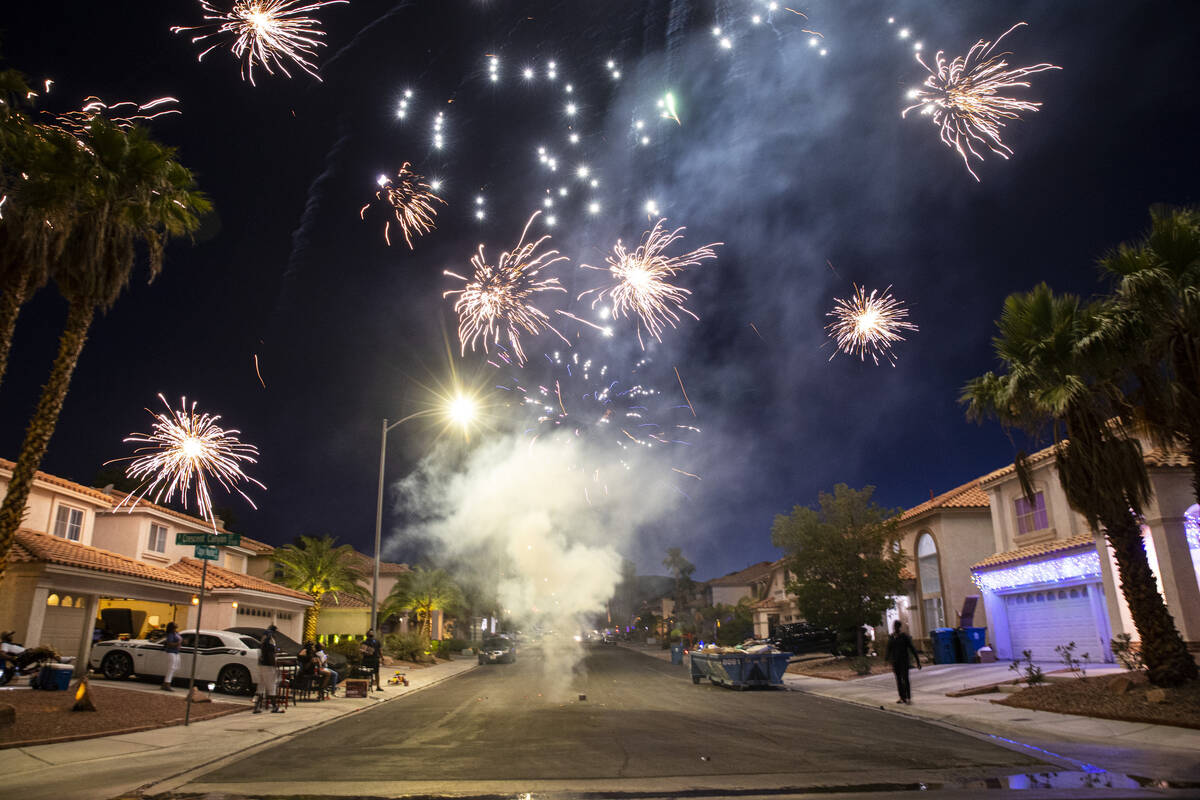 Fireworks go off on a residential neighborhood on Monday, July 4, 2022, in Las Vegas. (Chase St ...