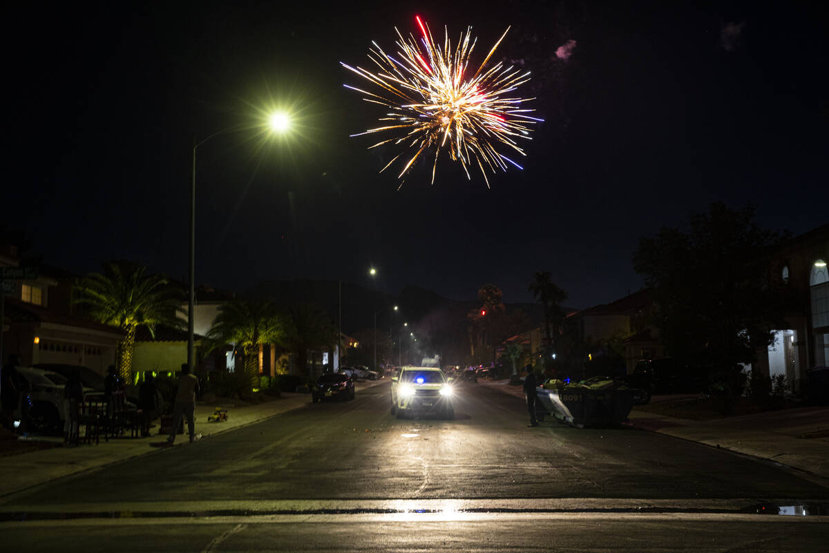 Fireworks go off on a residential neighborhood on Monday, July 4, 2022, in Las Vegas. (Chase St ...