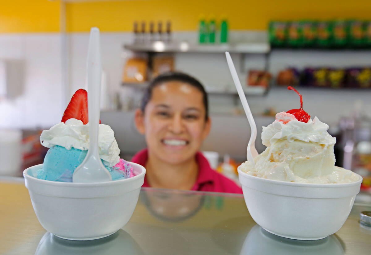 Staff member Nayeli Gonzalez shows cups of ice cream at La Flor de Michoacan in Las Vegas, Satu ...