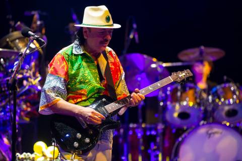 Carlos Santana performs a sound check after a press conference to announce an extension of Sant ...