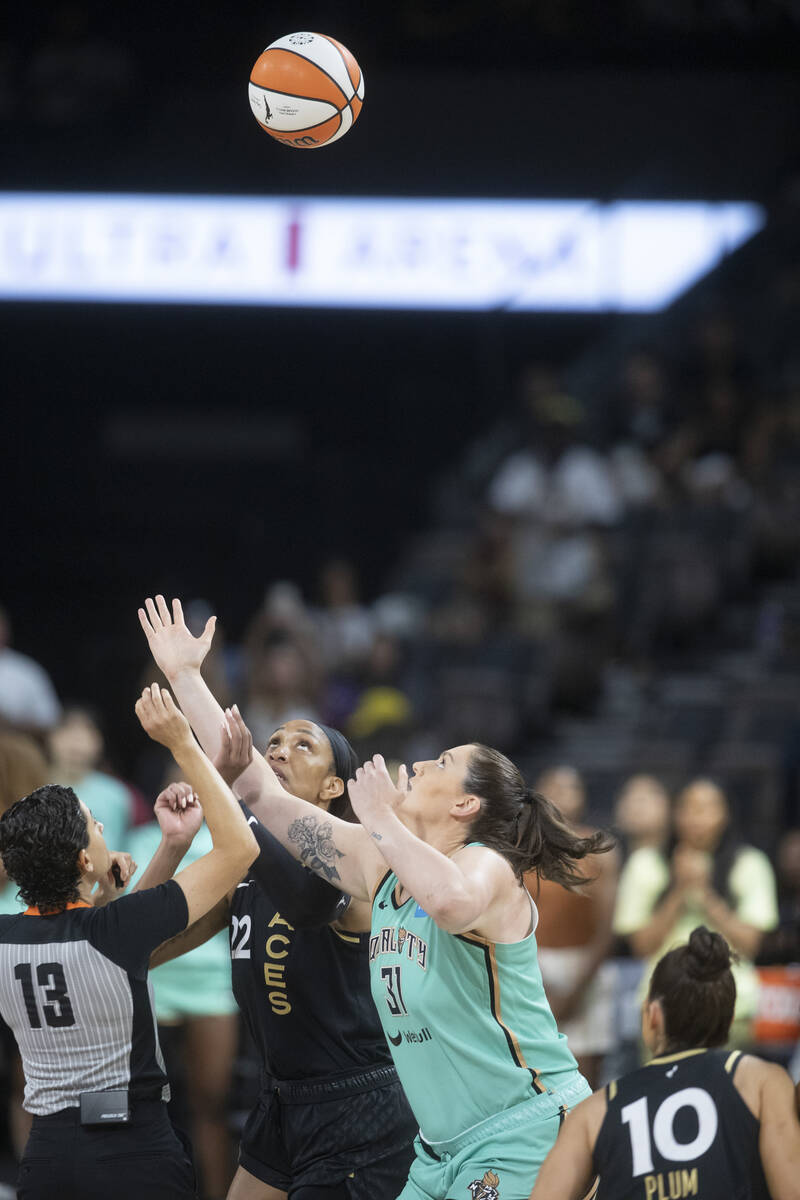 Las Vegas Aces forward A'ja WIlson (22) goes up for the opening tipoff against New York Liberty ...