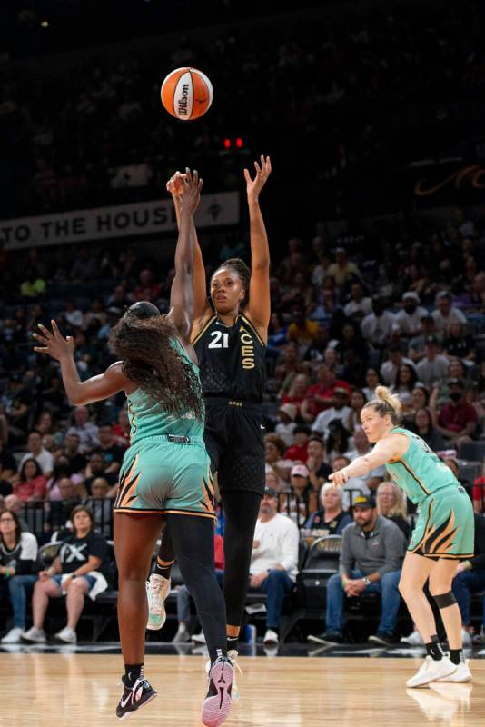 Las Vegas Aces center Iliana Rupert (21) takes a shot over New York Liberty's Michaela Onyenwer ...