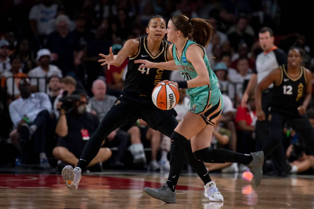 Las Vegas Aces center Kiah Stokes (41) guards New York Liberty's Sabrina Ionescu (20) during th ...