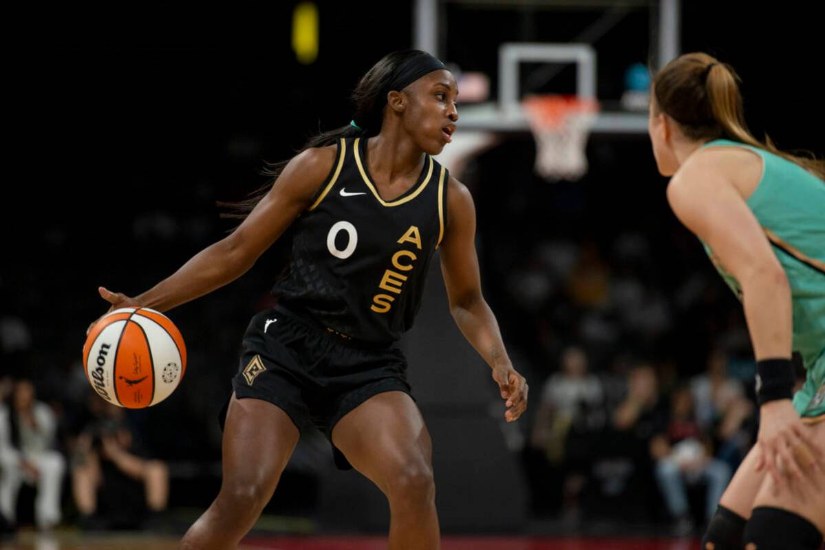 Las Vegas Aces guard Jackie Young (0) looks to move the ball during the Aces' game against the ...