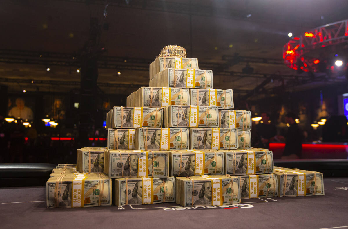 The newly designed World Series of Poker Main Event gold bracelet is pictured atop the winning ...