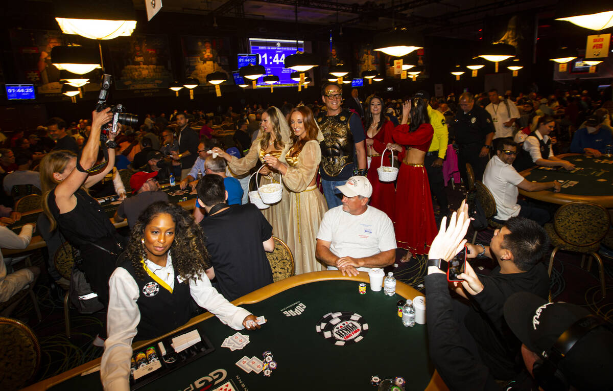 Actor and World Series of Poker master of ceremonies Vince Vaughn walks by tables during the WS ...