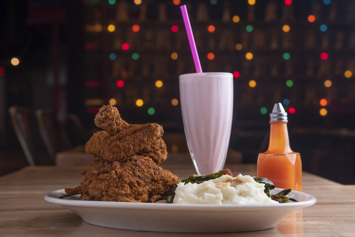 The fried chicken dinner with hot sauce and a strawberry milkshake at Brooklyn Bowl on Friday, ...