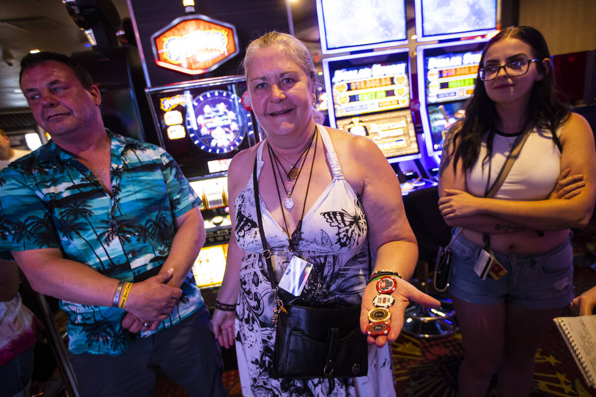Juli Mangun, of Calif., shows off her YouTuber Brian Christopher chips while attending the unve ...