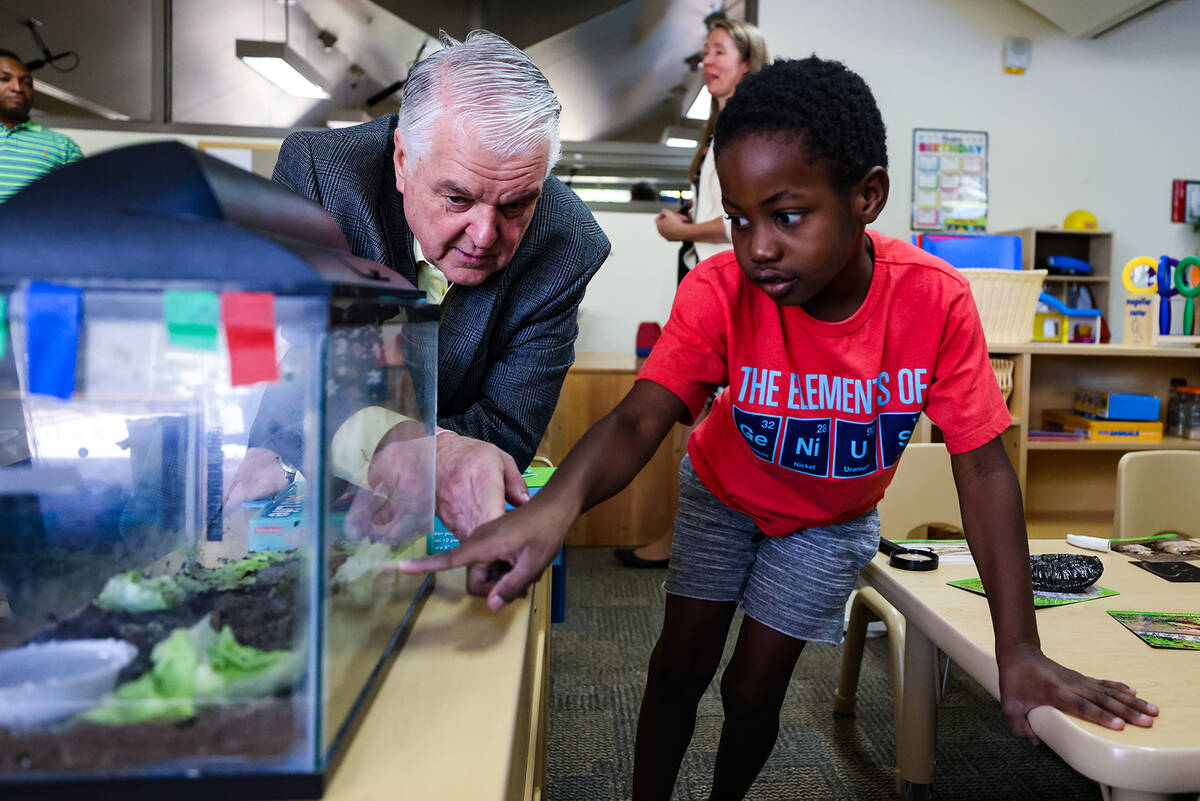 Gov. Steve Sisolak hangs out with Robert Lamoth-Nix, 5, at the College of Southern Nevada&#x201 ...