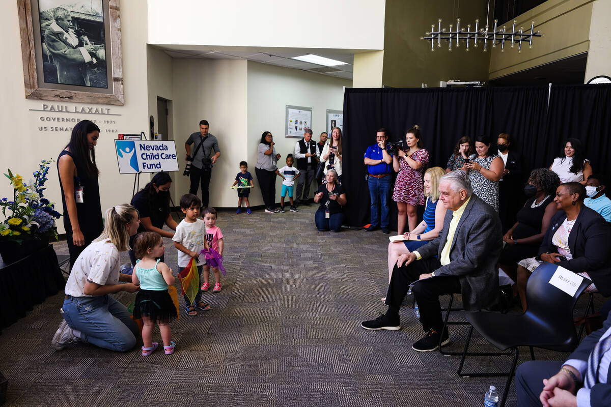Gov. Steve Sisolak enjoys a performance by the toddler group from the College of Southern Nevad ...