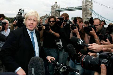 FILE - Britain Conservative Party MP, Boris Johnson, left, speaks to the media to launch his ca ...