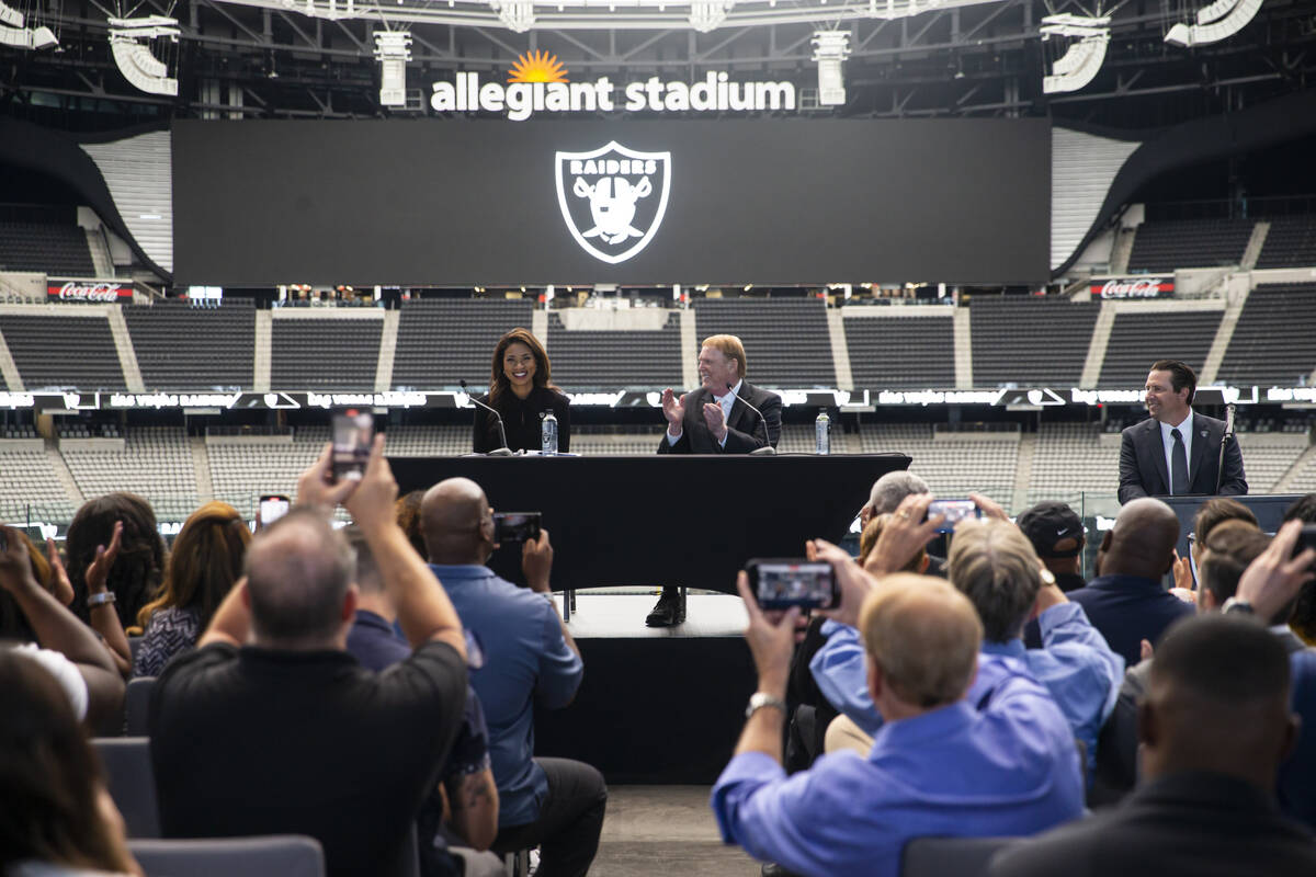 Raiders owner Mark Davis claps after announcing Sandra Douglass Morgan as the new president of ...