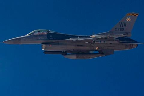 An F-16 flies alongside a KC-135 Stratotanker as it refuels planes around the Nevada Test and T ...