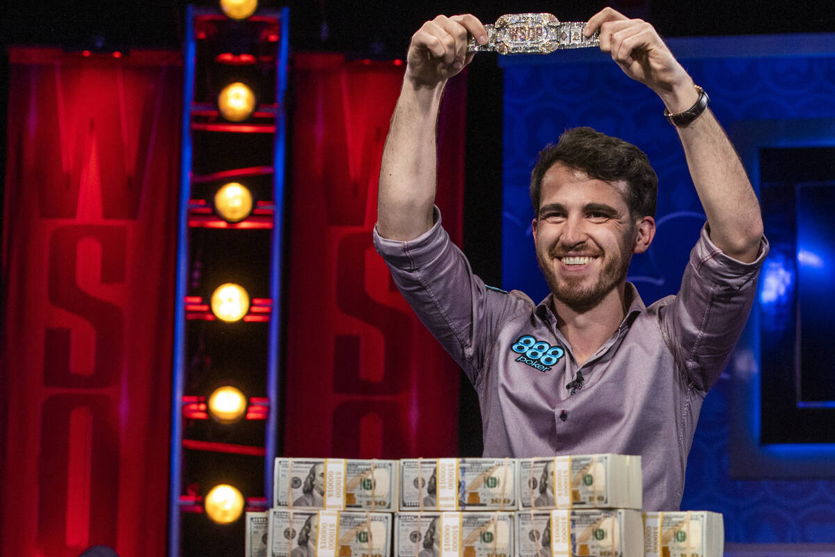Winner Koray Aldemir with his bracelet and stacks of cash at the final table for the $10,000 bu ...