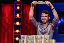 Winner Koray Aldemir with his bracelet and stacks of cash at the final table for the $10,000 bu ...