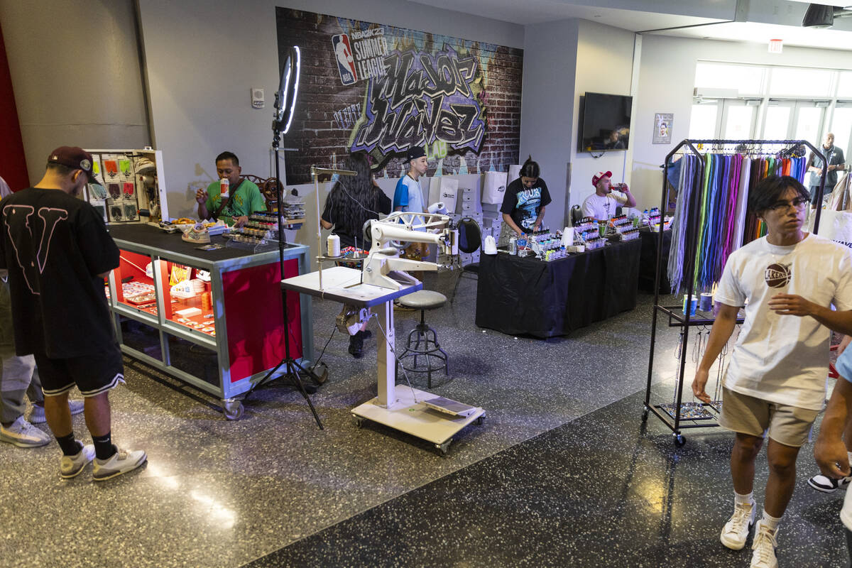 The Majorwavez lab booth customizes sneakers during the NBA Summer League event at the Thomas & ...