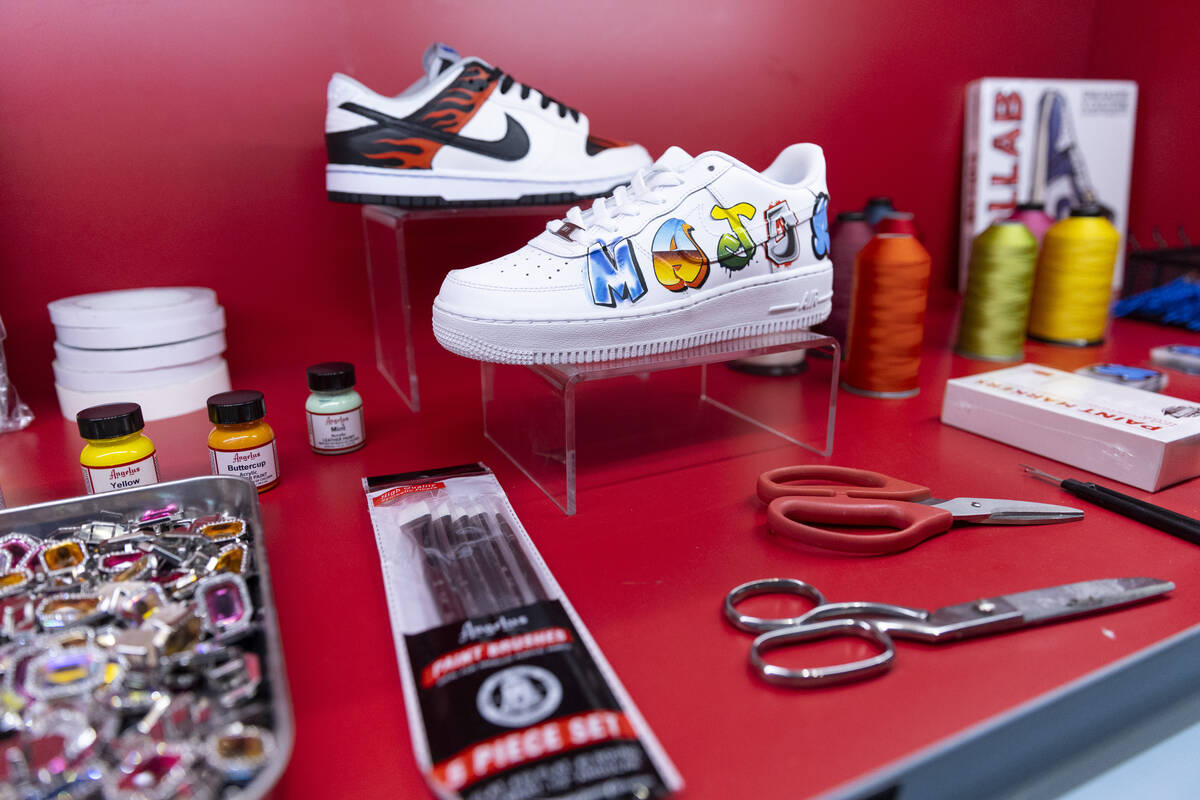 Custom sneakers are displayed at the Majorwavez lab booth during the NBA Summer League event at ...