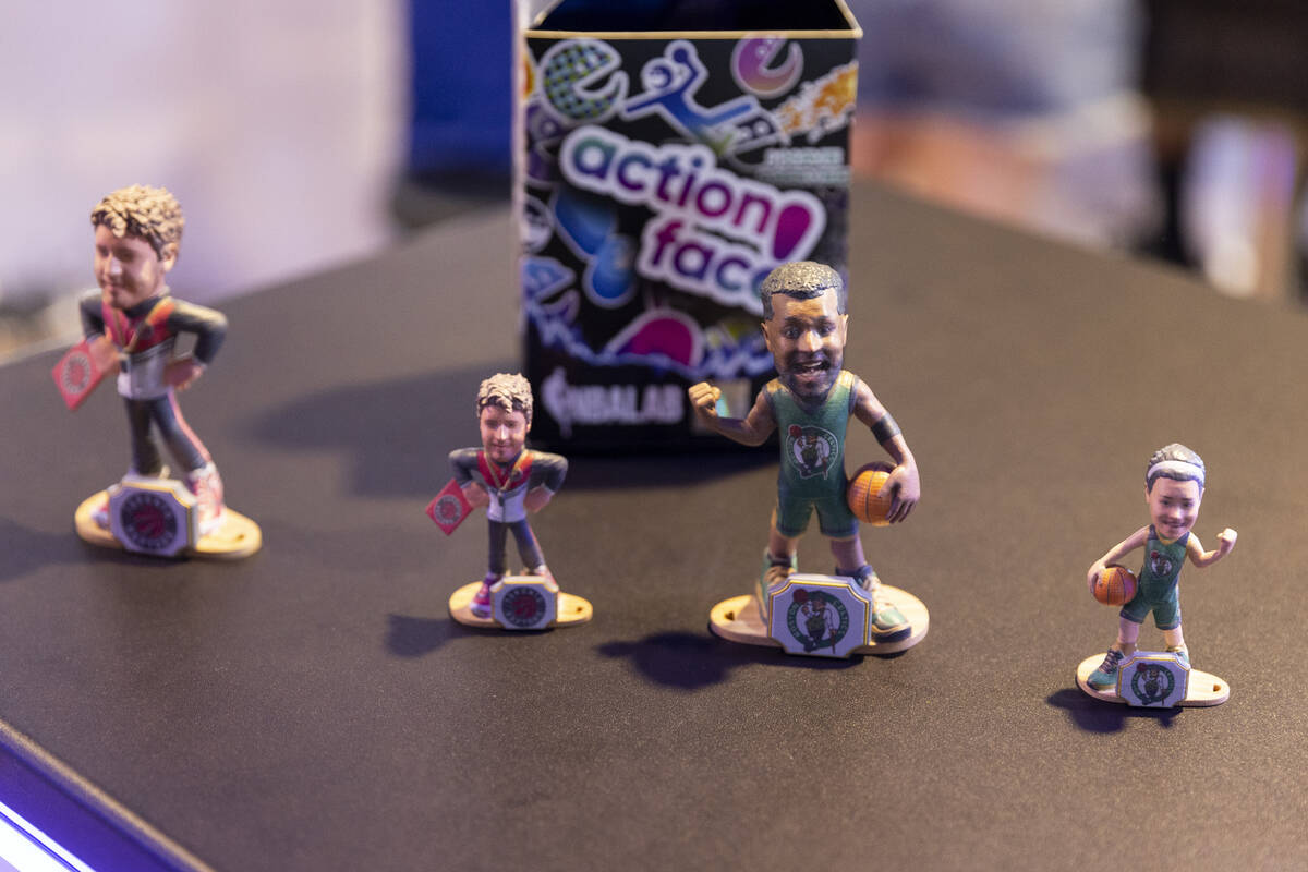 Custom basketball figures are displayed at the Action Face booth during the NBA Summer League e ...