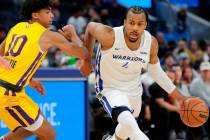 Moses Moody (4) drives up court in the first half as the Golden State Warriors played the Los A ...