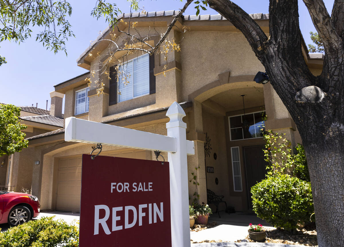 A Redfin for sale sign is posted outside a single family house on Wednesday, June 15, 2022, in ...