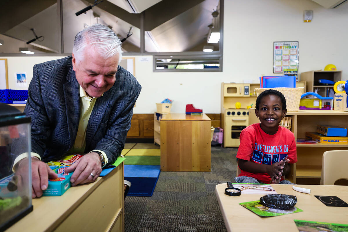 Gov. Steve Sisolak hangs out with Robert Lamoth-Nix, 5, at the College of Southern Nevadaȁ ...