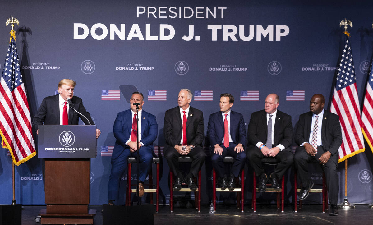 Former President Donald Trump speaks as Steve Grammas, second left, president of the Las Vegas ...